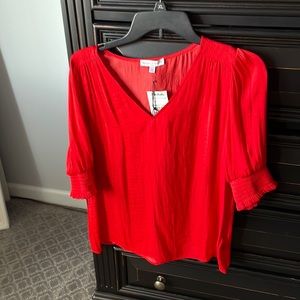 Red satiny blouse
